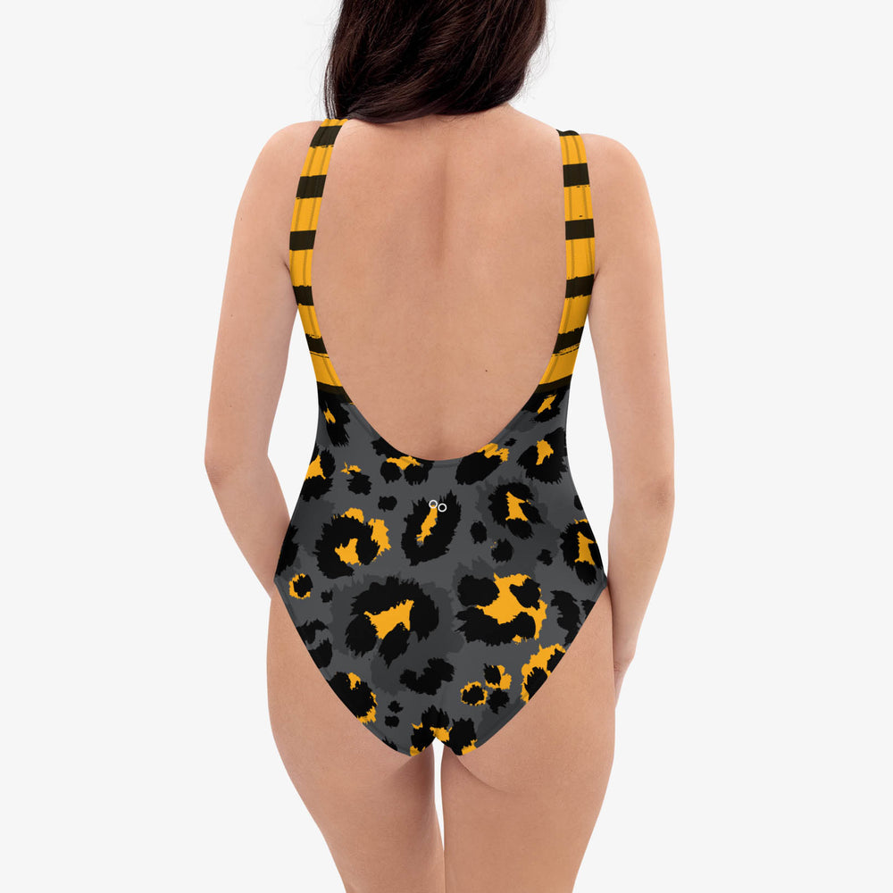 Another back view of one-piece swimsuit with abstract print.