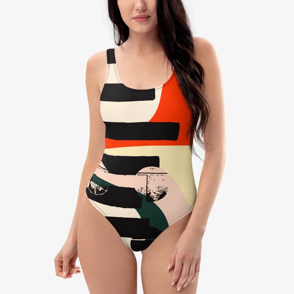 Front view of one-piece swimsuit with abstract print.