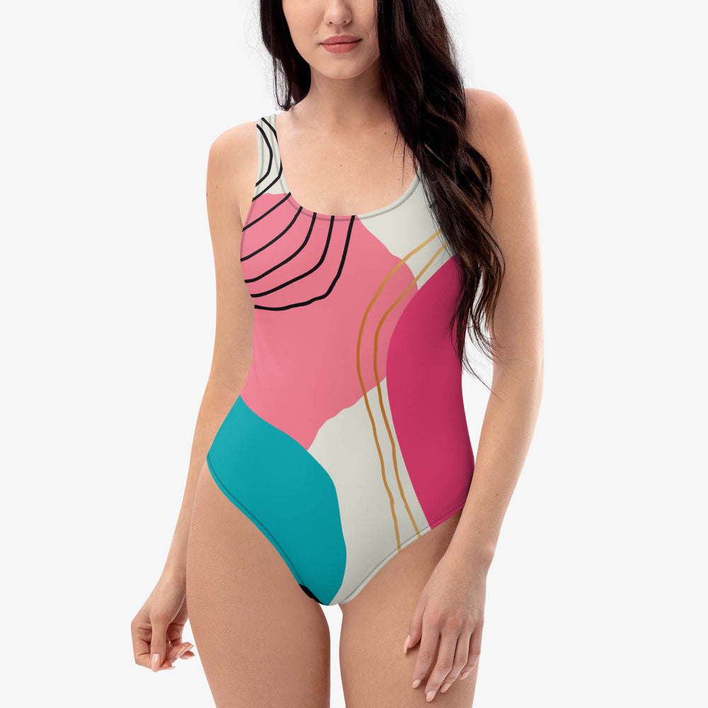 Front view of a white one-piece swimsuit with an abstract print.