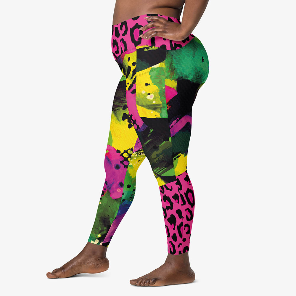 Left view of white recycled leggings with pockets and abstract print.