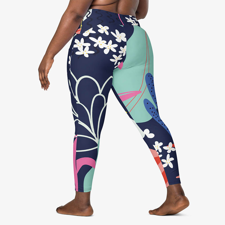 Left back view of white recycled leggings with pockets and an abstract print.