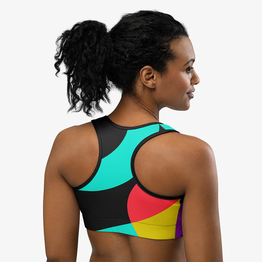 Another view of black sports bra with abstract print, back view.