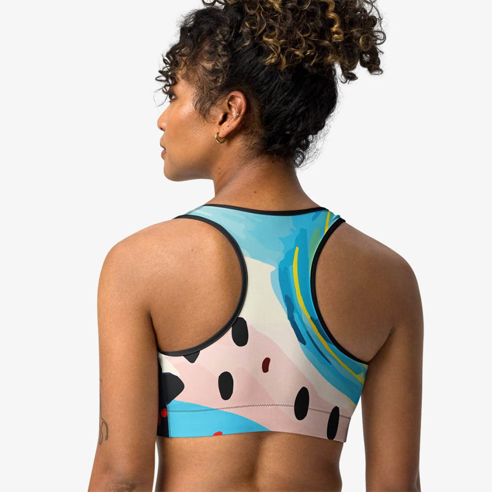 Back view of black sports bra with abstract print.