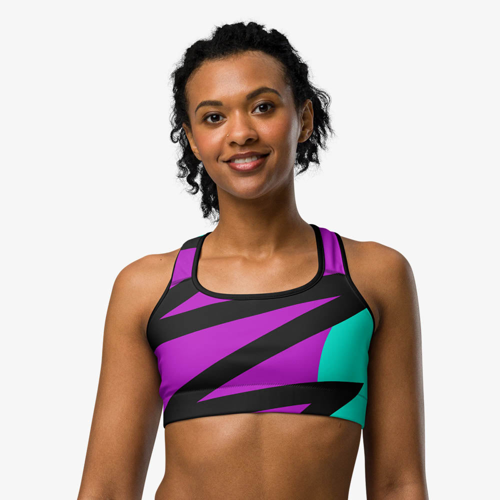 Close-up of black sports bra with abstract print, front view.