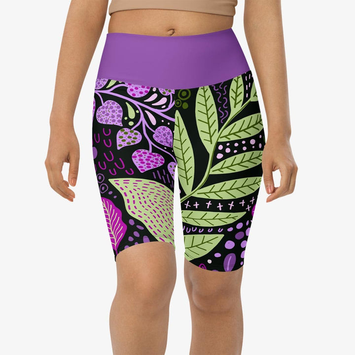 Close-up of purple biker shorts with abstract print on the front.