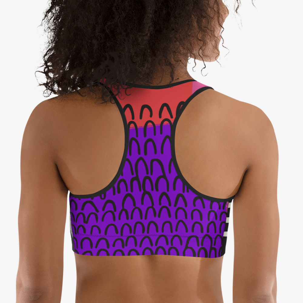 Black sports bra with an all-over abstract print, back view.