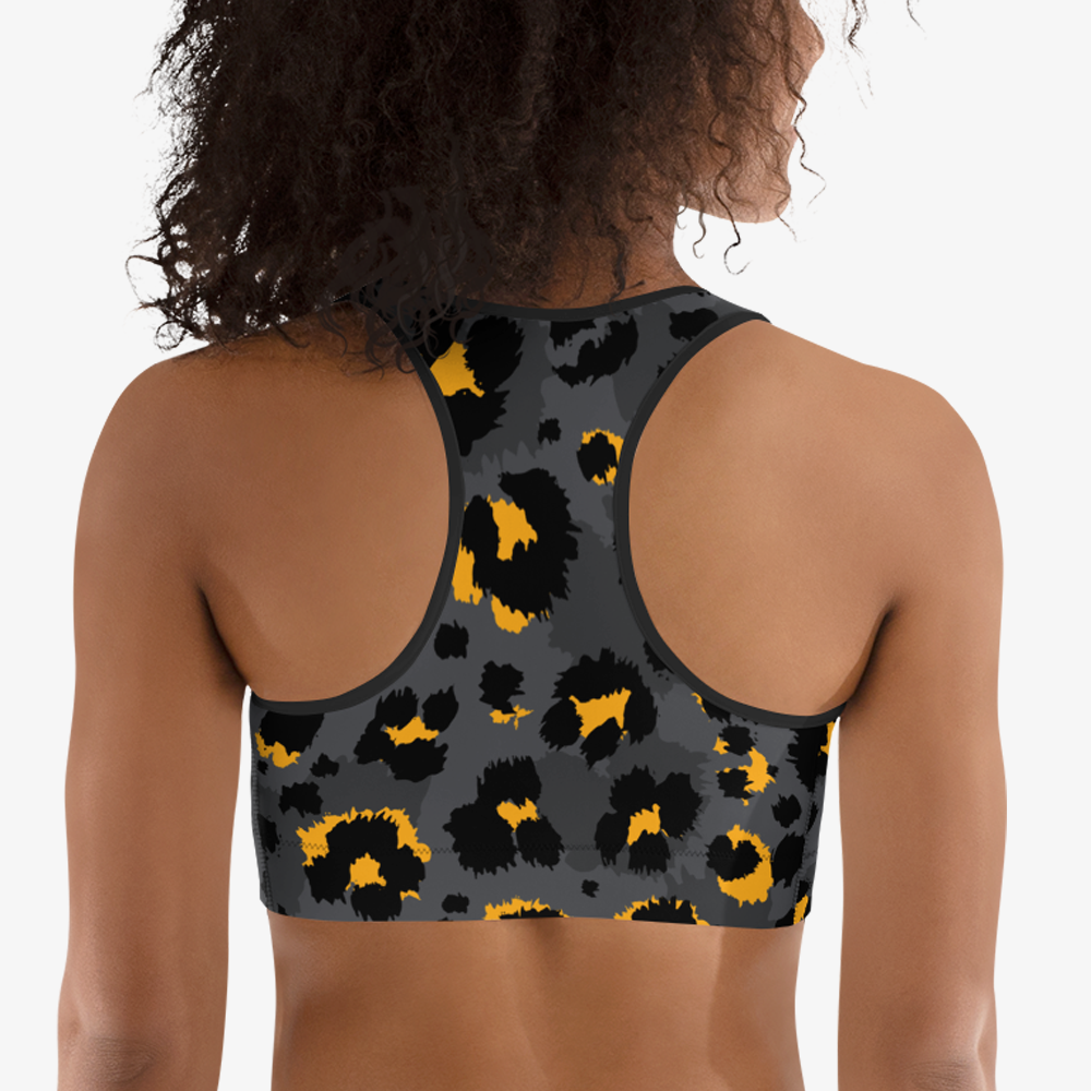Back view of black sports bra with abstract print.