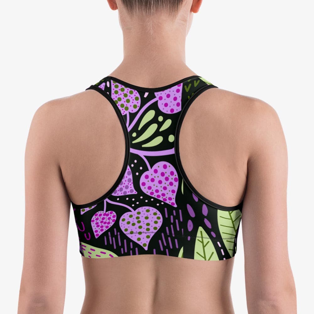 Back view of black sports bra with abstract print.