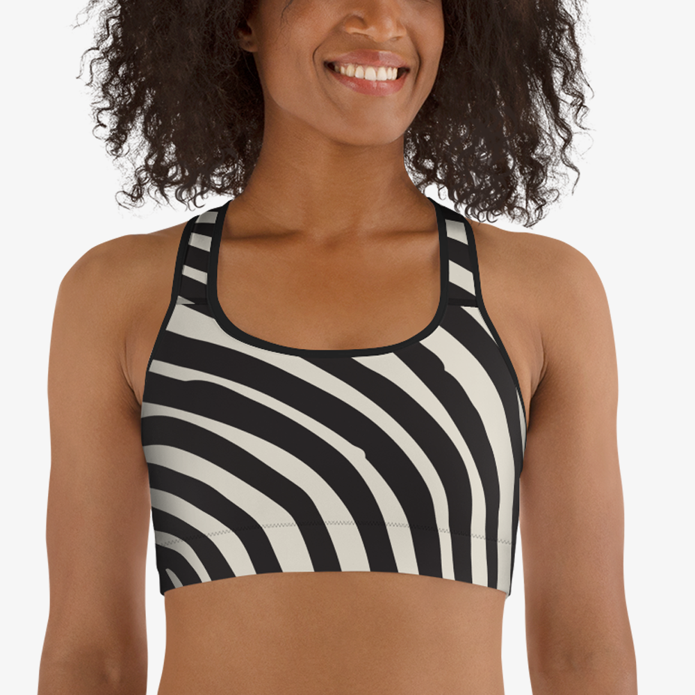 Black sports bra with an all-over abstract print, front view.