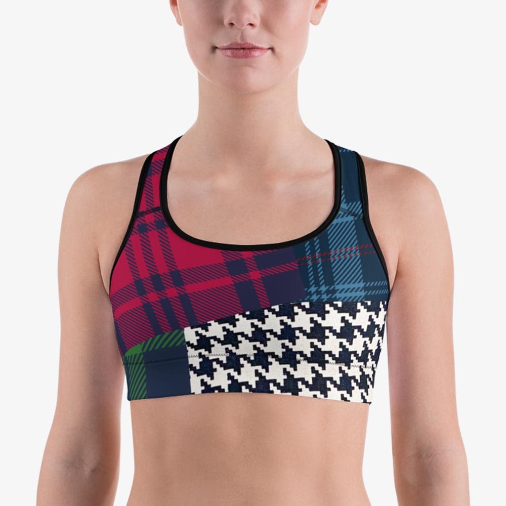 Close-up of black sports bra with abstract print, front view.