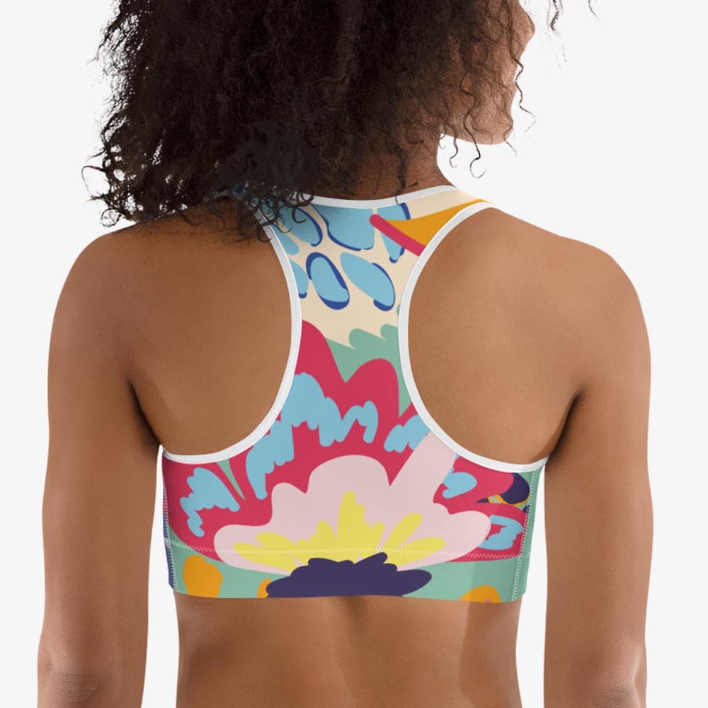Back view of white sports bra with abstract print.