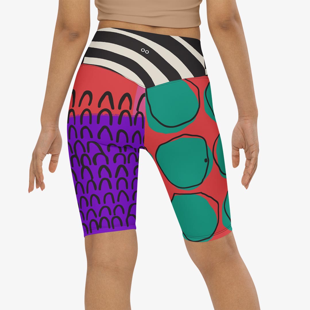 Back view of white biker shorts with abstract print.