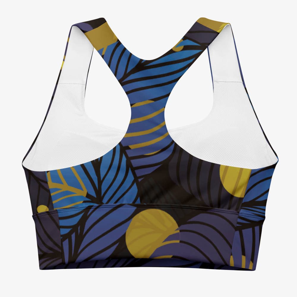 Back view of a white top with a blue and red abstract pattern.